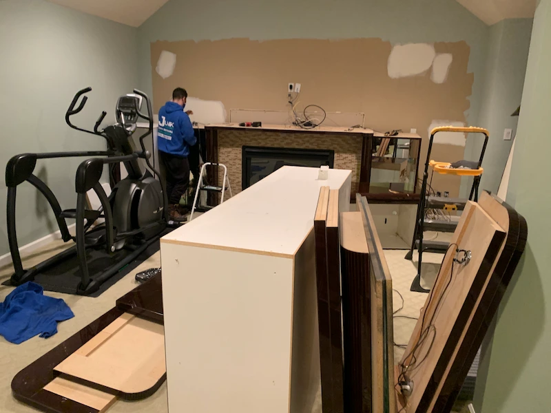 Basement wall unit and treadmill removal in New Jersey