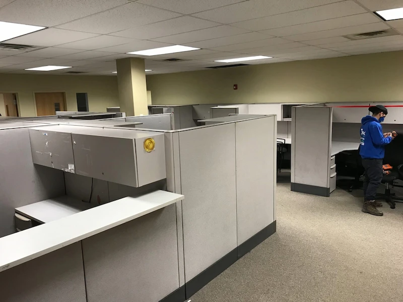 A Jersey City, North New Jersey commercial office filled with cubicles and furniture before a JunkDoctors cleanout.